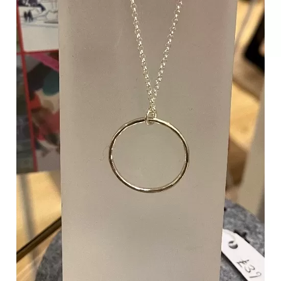 Sterling silver circle pendant on sterling silver chain