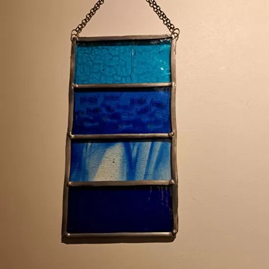 Stained glass blue fish panel