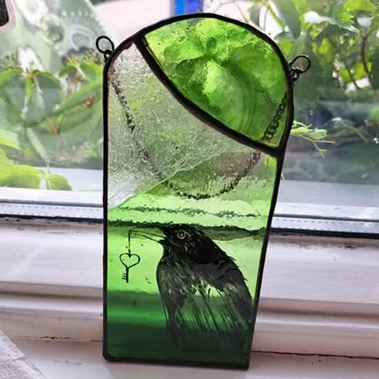 blackbird on green panel