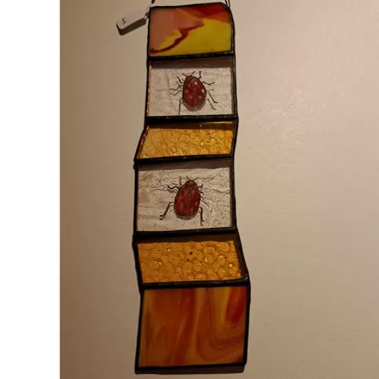 small stained glass insect panel