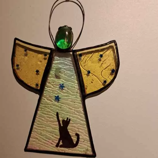 stained glass angel with animal