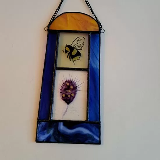 stained glass bee and flower panel